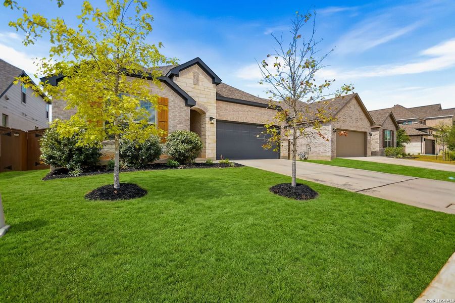 Front exterior of a new home in Corley Farms, Boerne, TX, highlighting curb appeal (Image 28). Front exterior of a new home in Corley Farms, Boerne, TX, highlighting curb appeal (Image 28).