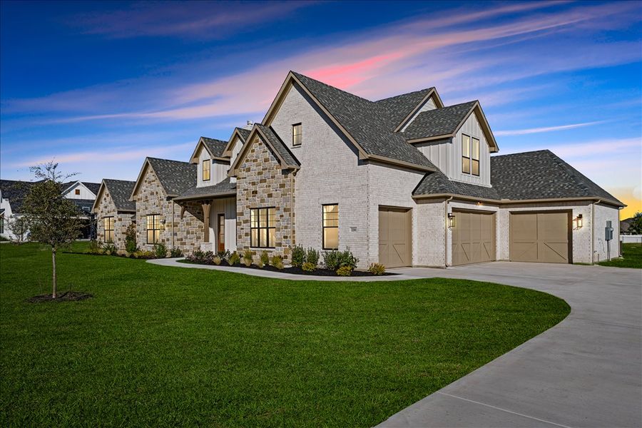 Front exterior of a new home in Stardust Ranch, Northlake, TX, highlighting curb appeal (Image 32). Front exterior of a new home in Stardust Ranch, Northlake, TX, highlighting curb appeal (Image 32).