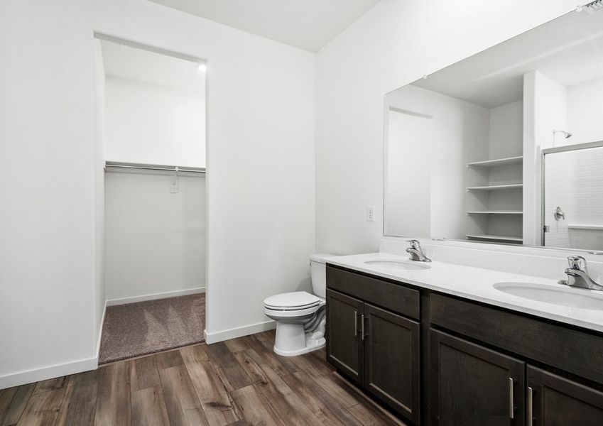 Plenty of shelving and storage in the master bathroom making getting ready easy.