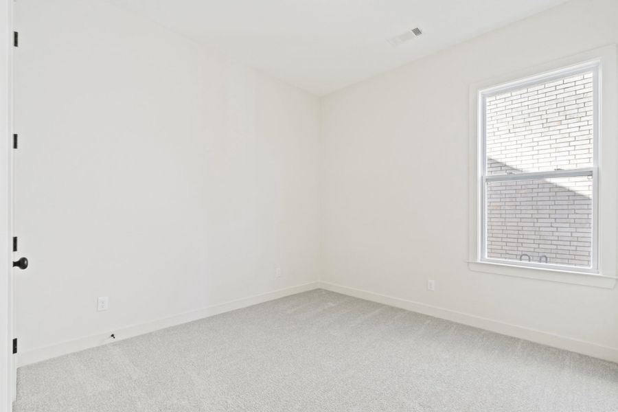 Unfurnished room featuring carpet and baseboards