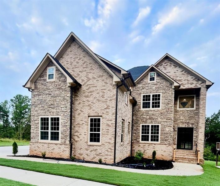 Front exterior of a new home in , Atlanta, GA, highlighting curb appeal (Image 1).