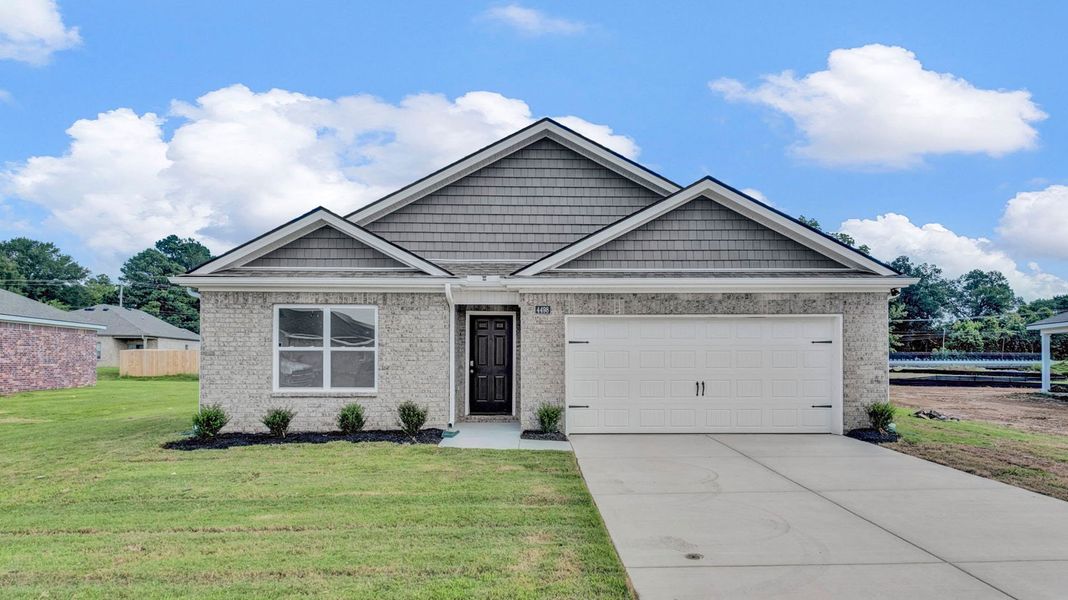 Front exterior of a new home in Riggs Pointe, Millington, TN, highlighting curb appeal (Image 2).