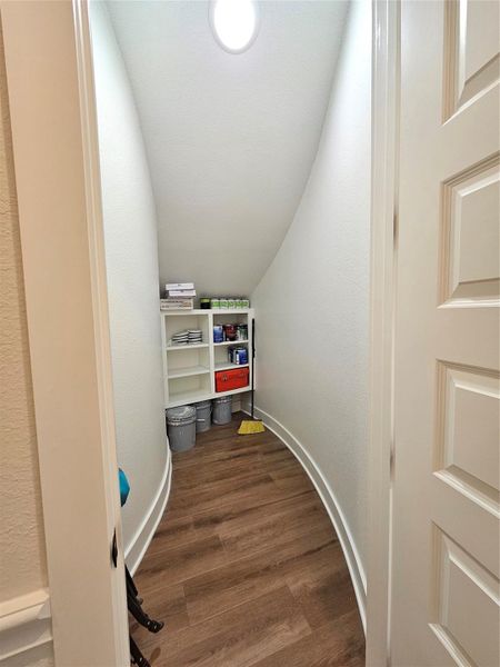 Cleverly designed under-stair storage maximizes space for organization and convenience.