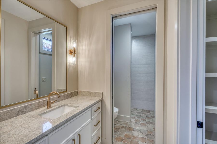 Full bathroom in guest quarters has walk-in shower & walk-in closet.