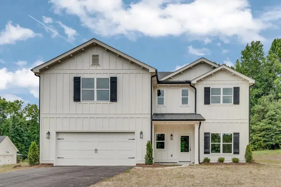 Front exterior of a new home in , Newborn, GA, highlighting curb appeal (Image 1). Front exterior of a new home in , Newborn, GA, highlighting curb appeal (Image 1).