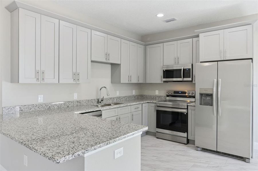 Furnished interior view inside a new home in , Kissimmee (Image 9).