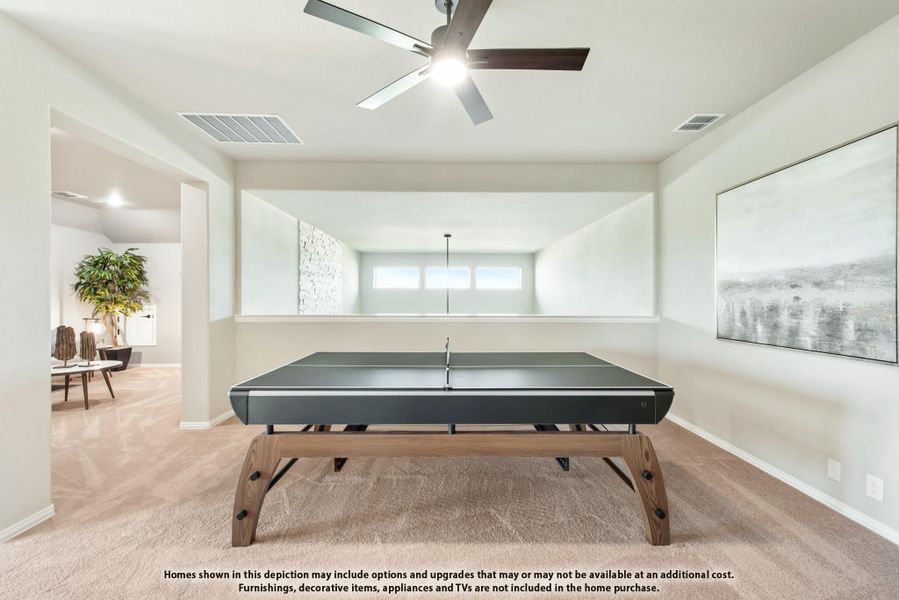 Game room with ping pong table, ceiling fan, and carpet flooring open to adjacent living area Game room with ping pong table, ceiling fan, and carpet flooring open to adjacent living area