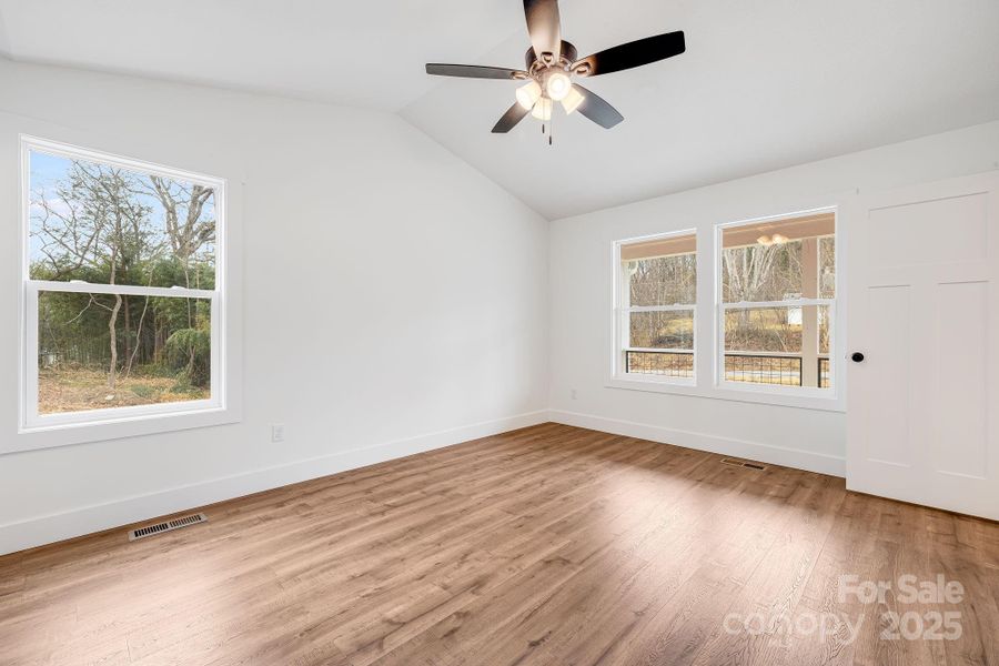 Primary Bedroom w/vaulted ceilings and fan