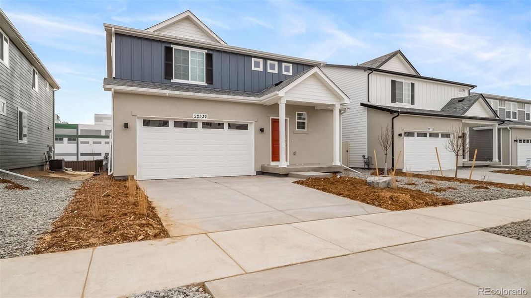 Front exterior of a new home in , Aurora, CO, highlighting curb appeal (Image 19).