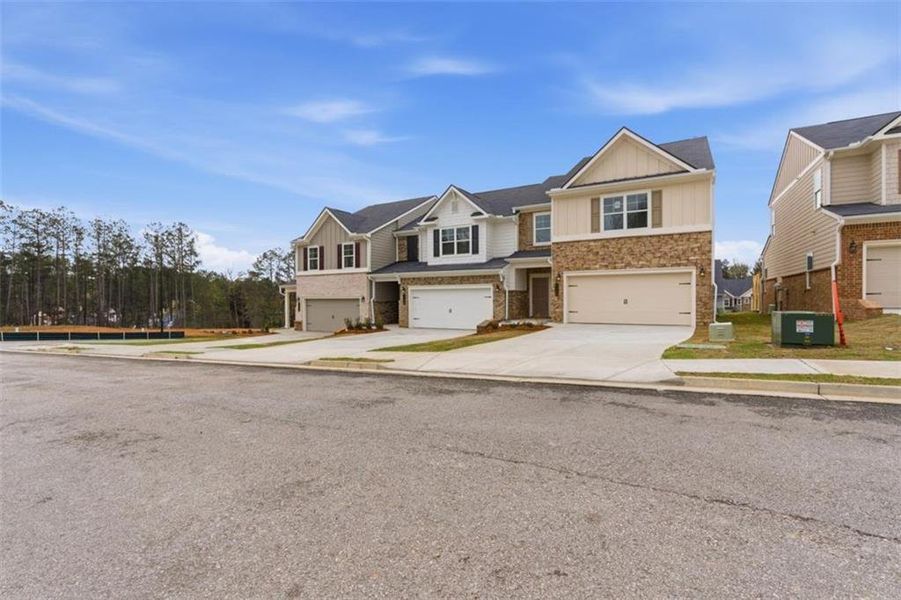 Front exterior of a new home in Park Center Pointe, Mableton, GA, highlighting curb appeal (Image 24).