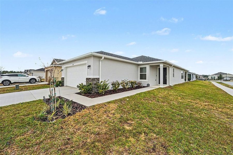 Front exterior of a new home in , Haines City, FL, highlighting curb appeal (Image 22). Front exterior of a new home in , Haines City, FL, highlighting curb appeal (Image 22).
