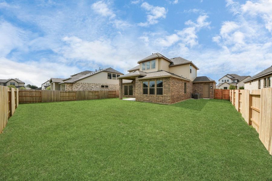 Front exterior of a new home in Marvida, Cypress, TX, highlighting curb appeal (Image 2). Front exterior of a new home in Marvida, Cypress, TX, highlighting curb appeal (Image 2).