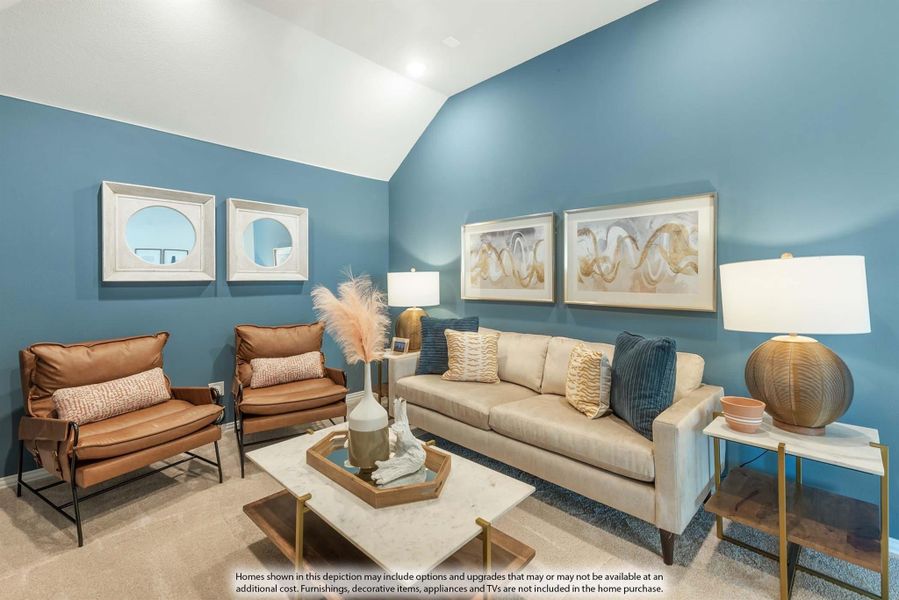 Living room with vaulted ceiling, blue walls, beige sofa, and two brown leather chairs Living room with vaulted ceiling, blue walls, beige sofa, and two brown leather chairs
