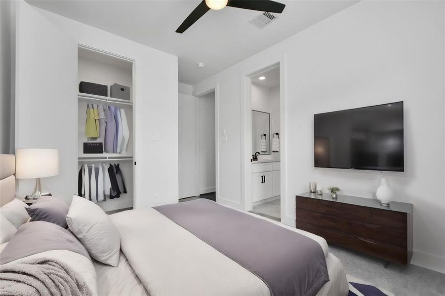 Unwind in the comfort of this inviting second of 2 guest bedrooms, featuring elegant ceiling fan, walk in closet, plus carpeted floor and abundant natural light