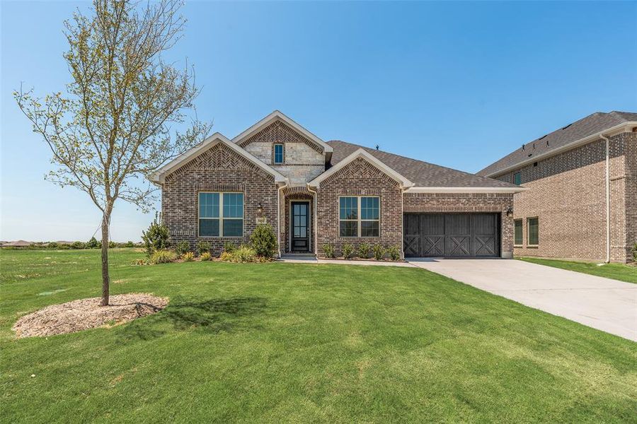 Front exterior of a new home in Villages of Creekwood, Frisco, TX, highlighting curb appeal (Image 20). Front exterior of a new home in Villages of Creekwood, Frisco, TX, highlighting curb appeal (Image 20).
