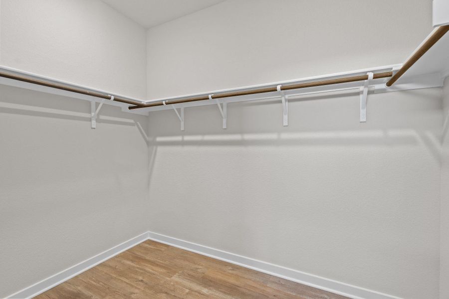 Walk-in closet in Primary Bedroom Walk-in closet in Primary Bedroom