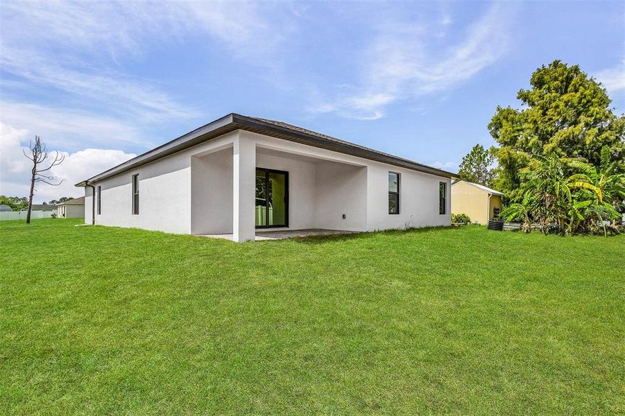 Front exterior of a new home in , Port Charlotte, FL, highlighting curb appeal (Image 1).