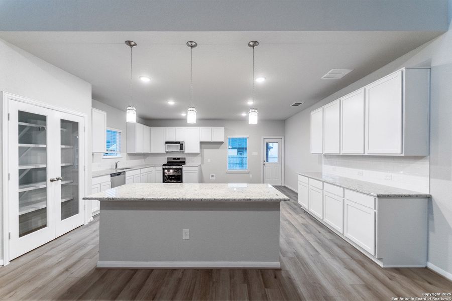 Furnished interior view inside a new home in Hennersby Hollow, San Antonio (Image 4).