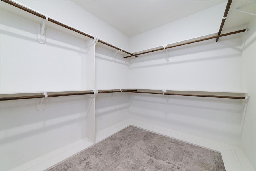 Primary walk-in closet Primary walk-in closet