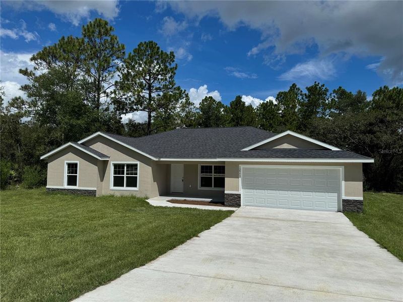 Front exterior of a new home in , Dunnellon, FL, highlighting curb appeal (Image 21).