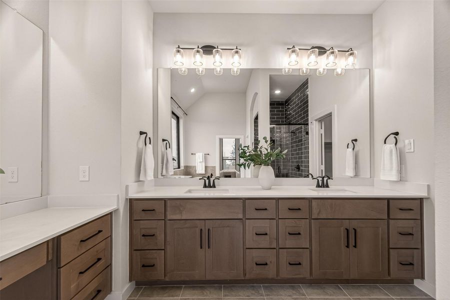 WoW!  Style, Sophistication and Beauty. Carmelo maple cabinets and dual sink vanity.  Very Nice!!