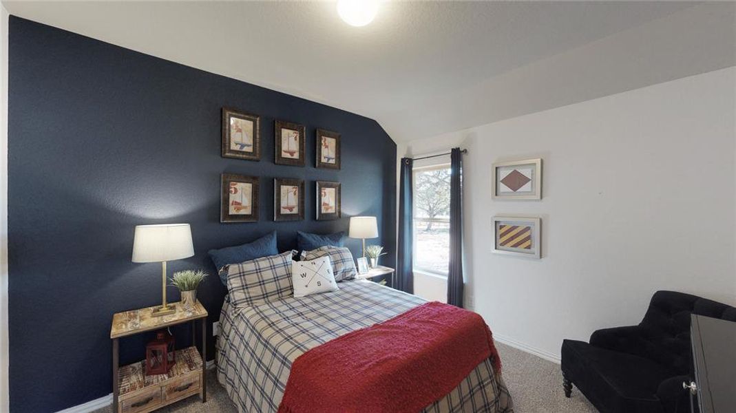 Bedroom with lofted ceiling and carpet Bedroom with lofted ceiling and carpet