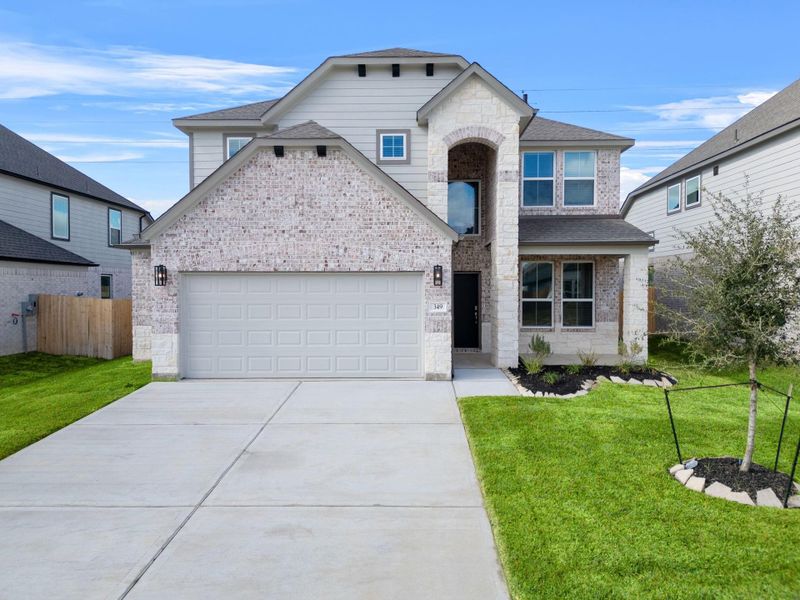 Front exterior of a new home in Beacon Hill, Waller, TX, highlighting curb appeal (Image 15). Front exterior of a new home in Beacon Hill, Waller, TX, highlighting curb appeal (Image 15).