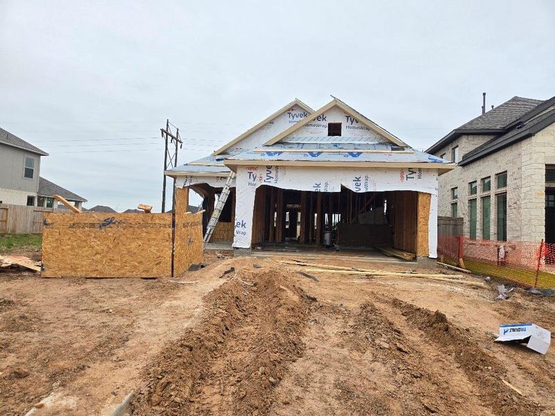 Front exterior of a new home in Sienna 40', Missouri City, TX, highlighting curb appeal (Image 9).