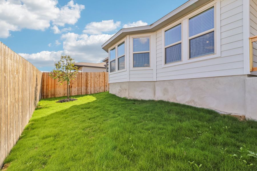 Back exterior of the Briscoe floorplan at a Meritage Homes community.