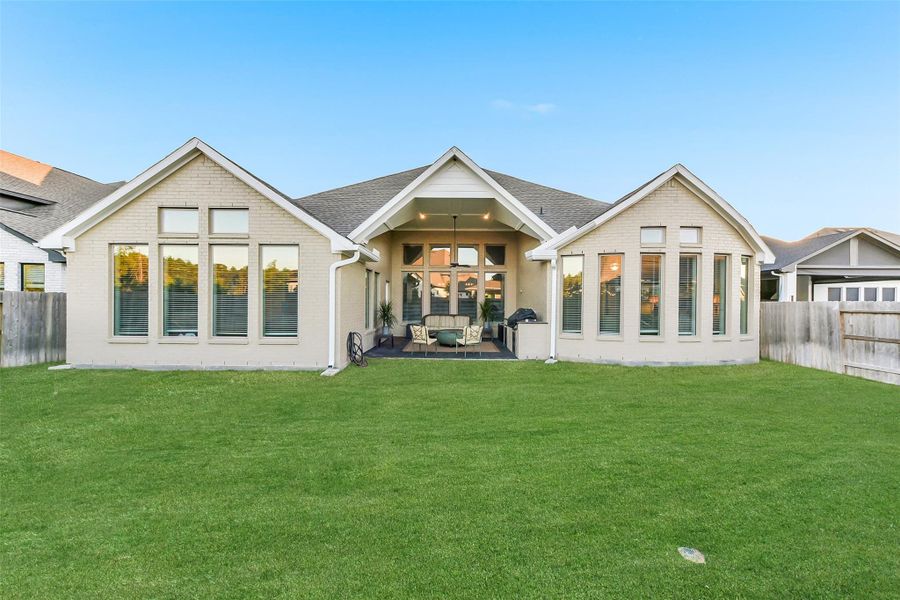 Exterior details and patio area of a home in ARTAVIA 65', Conroe (Image 21).
