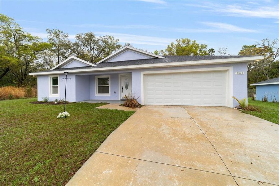 Front exterior of a new home in , Dunnellon, FL, highlighting curb appeal (Image 22). Front exterior of a new home in , Dunnellon, FL, highlighting curb appeal (Image 22).