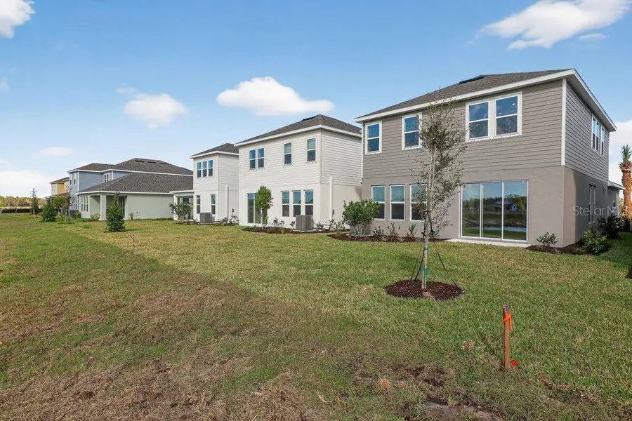 Exterior details and patio area of a home in Firethorn, Parrish (Image 23).