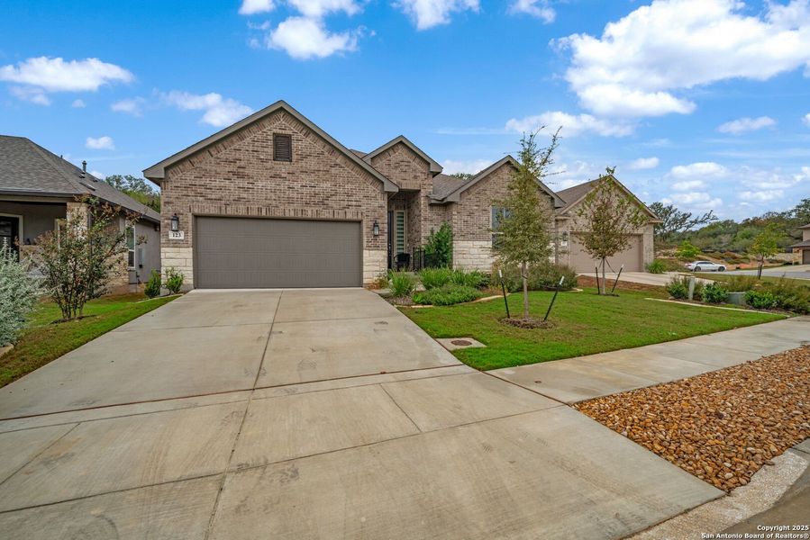 Front exterior of a new home in Cibolo Crossing, Universal City, TX, highlighting curb appeal (Image 2).