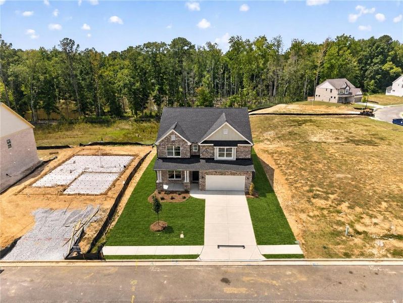 Front exterior of a new home in , Loganville, GA, highlighting curb appeal (Image 28).
