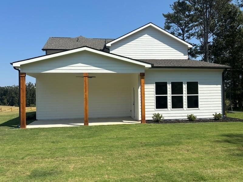 Front exterior of a new home in Pinegate, Covington, GA, highlighting curb appeal (Image 26). Front exterior of a new home in Pinegate, Covington, GA, highlighting curb appeal (Image 26).