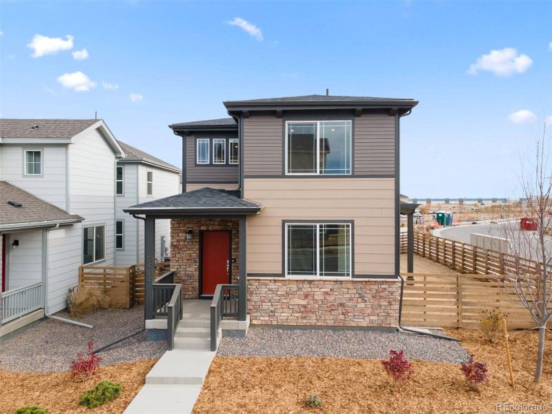 Front exterior of a new home in , Aurora, CO, highlighting curb appeal (Image 1).