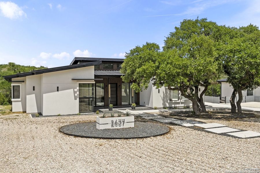 Front exterior of a new home in , Spring Branch, TX, highlighting curb appeal (Image 2).