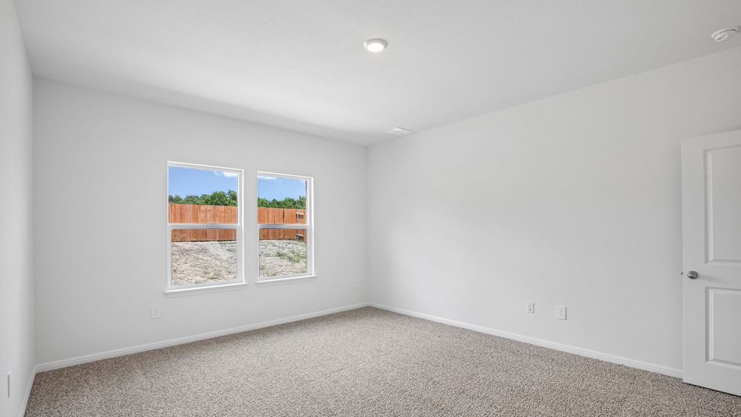 Spacious, unfurnished interior of a new home in Bar W Ranch, Leander (Image 23).