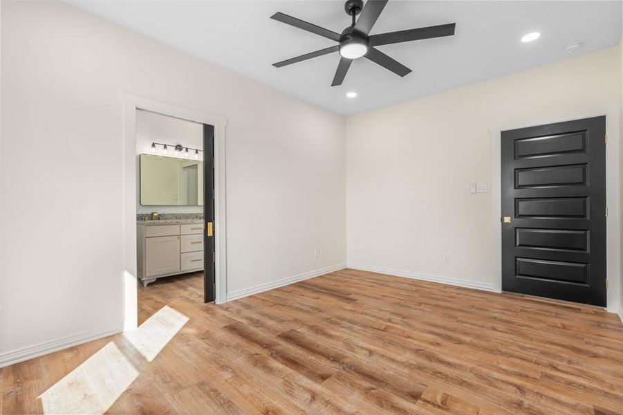 Primary bedroom with pocket door to private ensuite Primary bedroom with pocket door to private ensuite