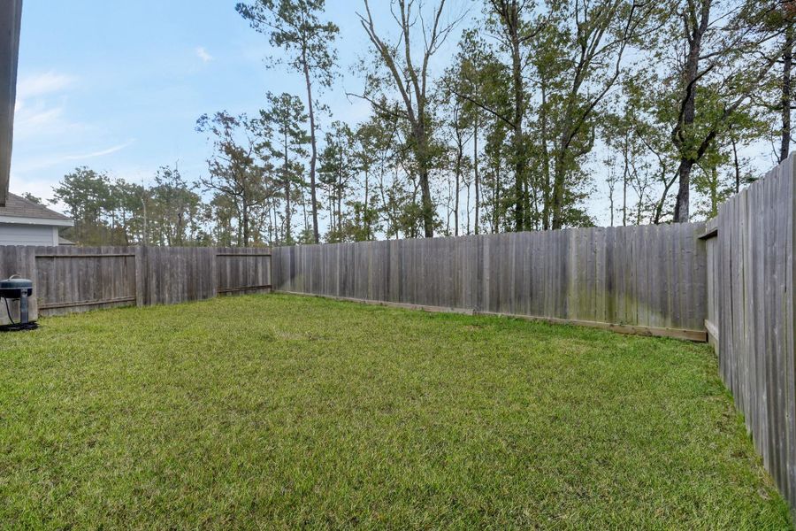 Exterior details and patio area of a home in Townsend Reserve, Splendora (Image 24).