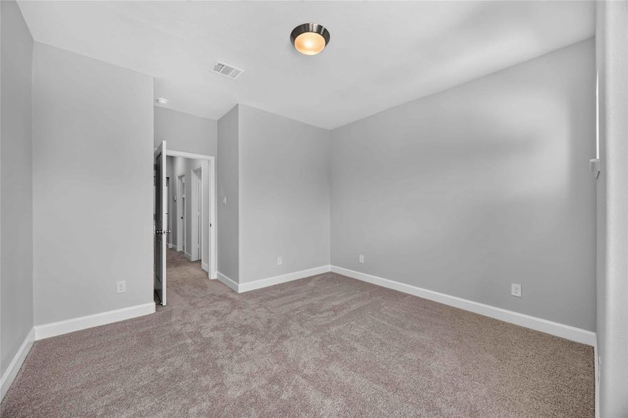 Comfort Meets Function – With plenty of natural light and generous closet space, this bedroom checks every box.