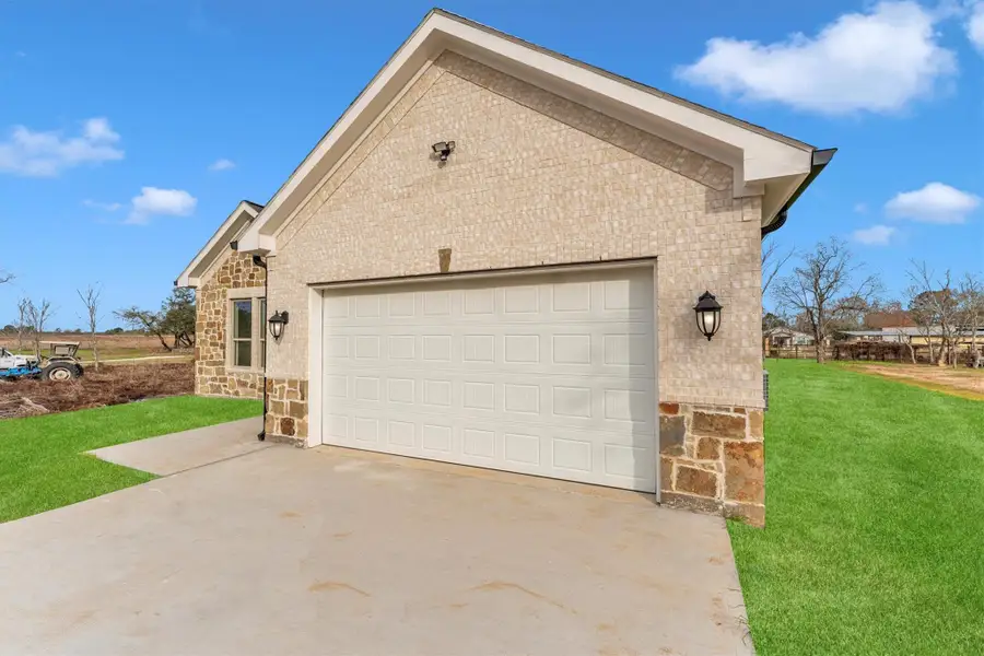 Front exterior of a new home in , Prairie View, TX, highlighting curb appeal (Image 1). Front exterior of a new home in , Prairie View, TX, highlighting curb appeal (Image 1).