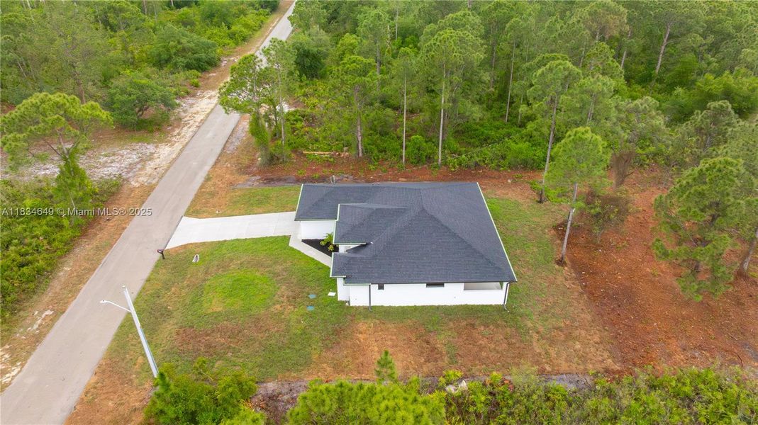 Front exterior of a new home in , Lehigh Acres, FL, highlighting curb appeal (Image 23).