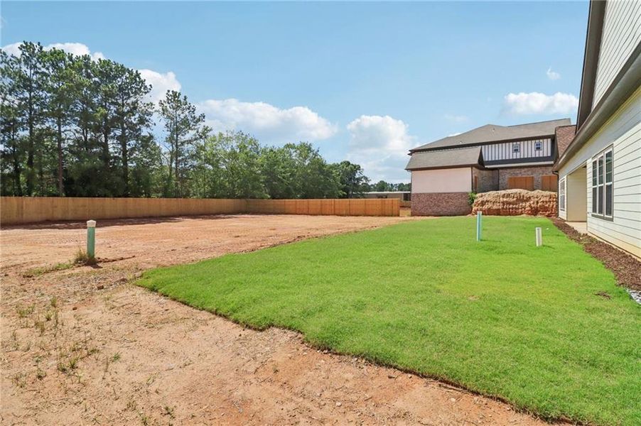 Front exterior of a new home in , Lilburn, GA, highlighting curb appeal (Image 30).