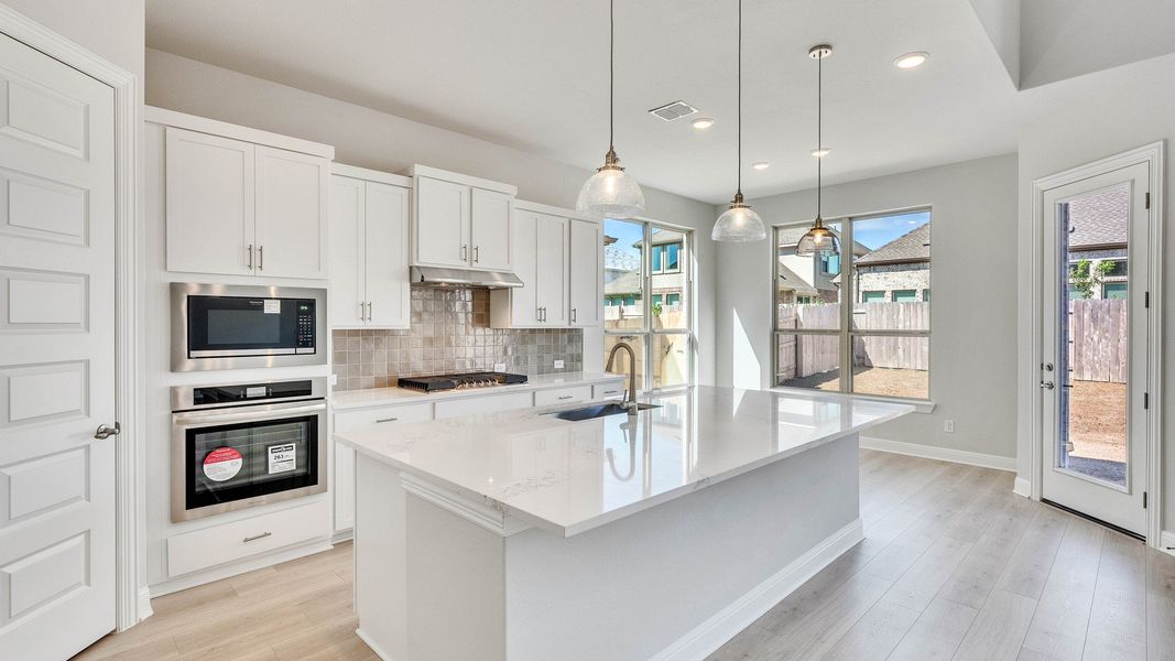 Furnished interior view inside a new home in Hawkes Landing, Leander (Image 3).