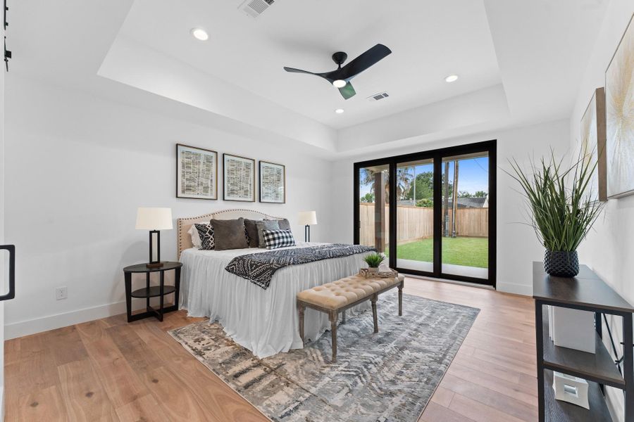 A true owner’s retreat, anchored by a tray ceiling, recessed lighting, and peaceful backyard access. A true owner’s retreat, anchored by a tray ceiling, recessed lighting, and peaceful backyard access.