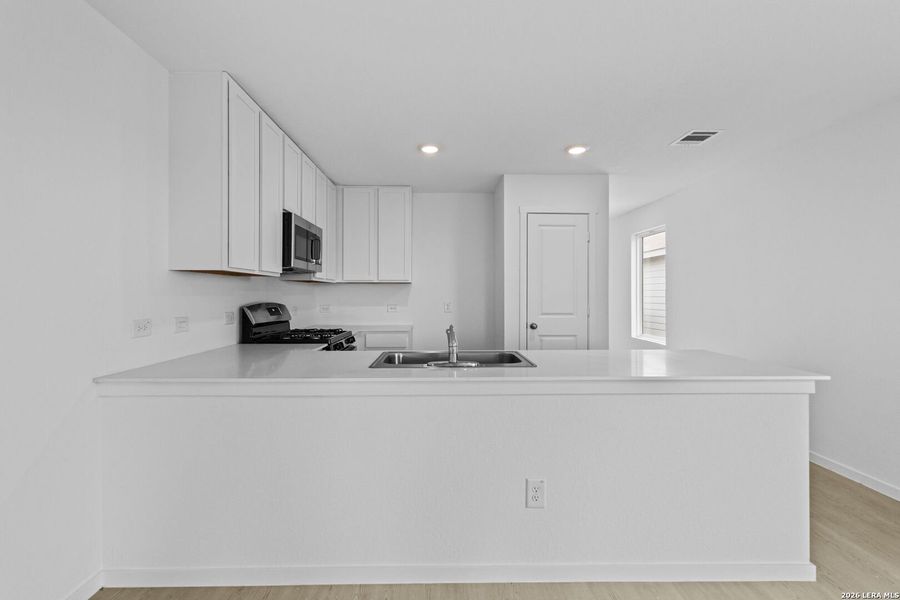 Furnished interior view inside a new home in Spring Grove, St. Hedwig (Image 4).