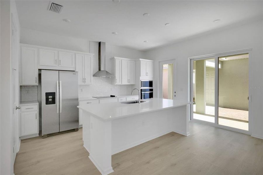 Furnished interior view inside a new home in Serenade at Ovation, Winter Garden (Image 13).