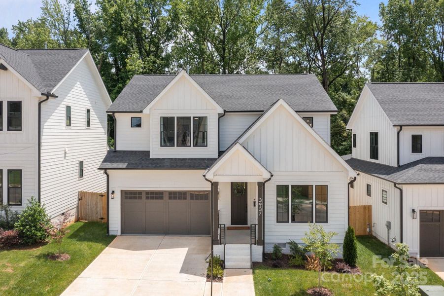 Front exterior of a new home in , Charlotte, NC, highlighting curb appeal (Image 1).
