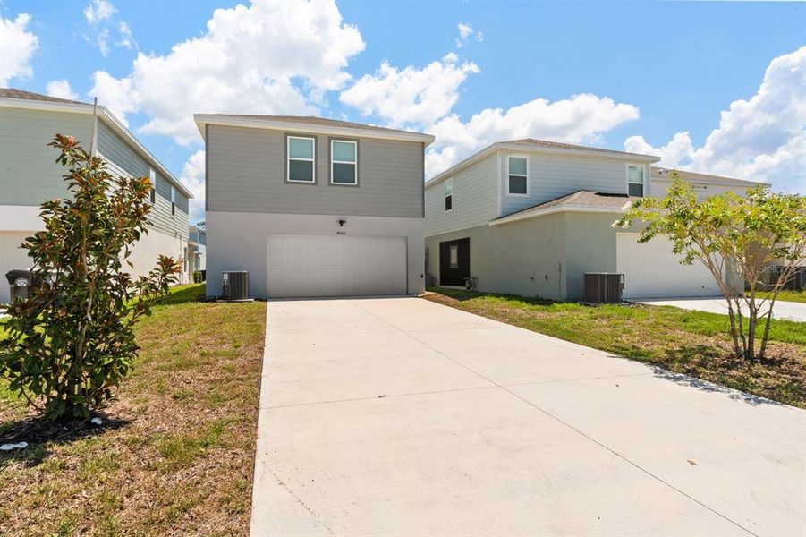 Front exterior of a new home in , Apopka, FL, highlighting curb appeal (Image 2).
